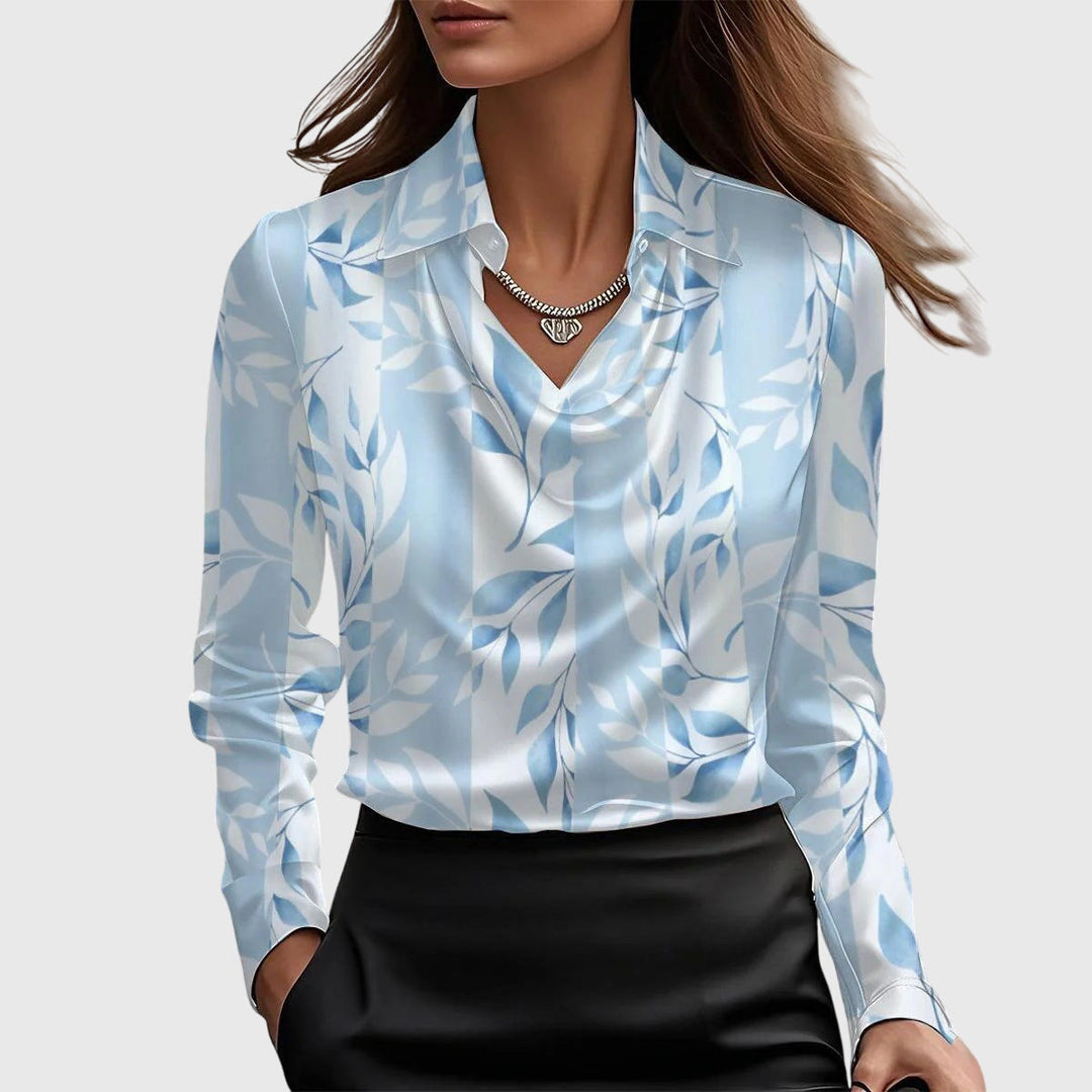 Chemisier femme à col soigné, manches longues, élégant et confortable, idéal pour diverses occasions.