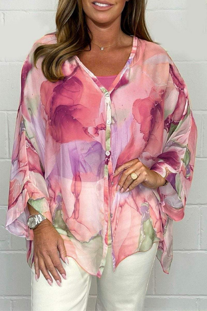 Blouse femme oversize décontractée et élégante avec un motif abstrait, parfaite pour un style chic.