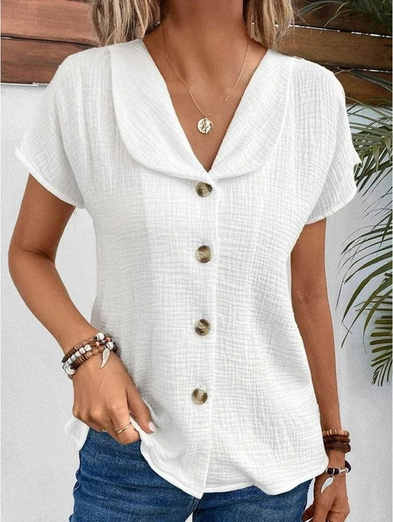 Chemisier texturé pour femme avec boutons centraux, style chic et polyvalent à manches courtes.