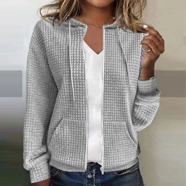 Sweatshirt femme casual zippé à capuche, parfait pour toute occasion décontractée. Style polyvalent et tendance.