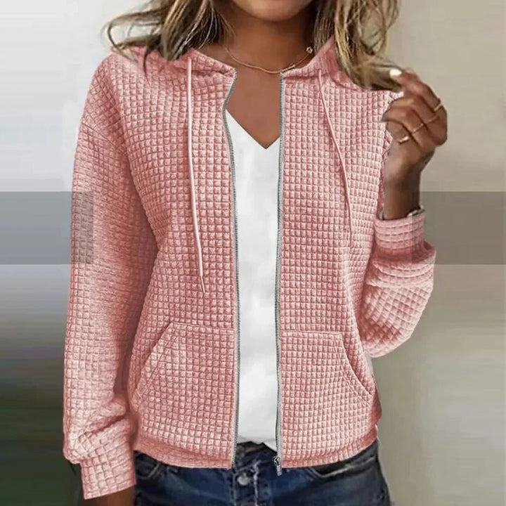 Sweat zippé femme à capuche décontracté, idéal pour un look casual confortable. Mode féminine polyvalente.