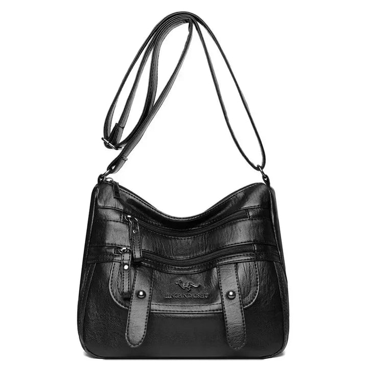 Sac à main femme noir polyvalent en cuir souple, parfait pour toutes les occasions élégantes.