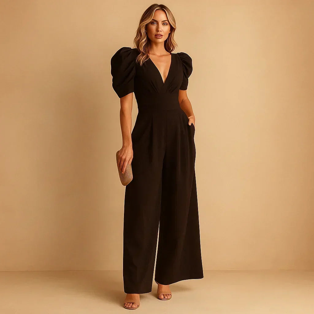 Jumpsuit élégante pour femme avec manches bouffantes volumineuses et coupe ajustée, idéale pour événements habillés.