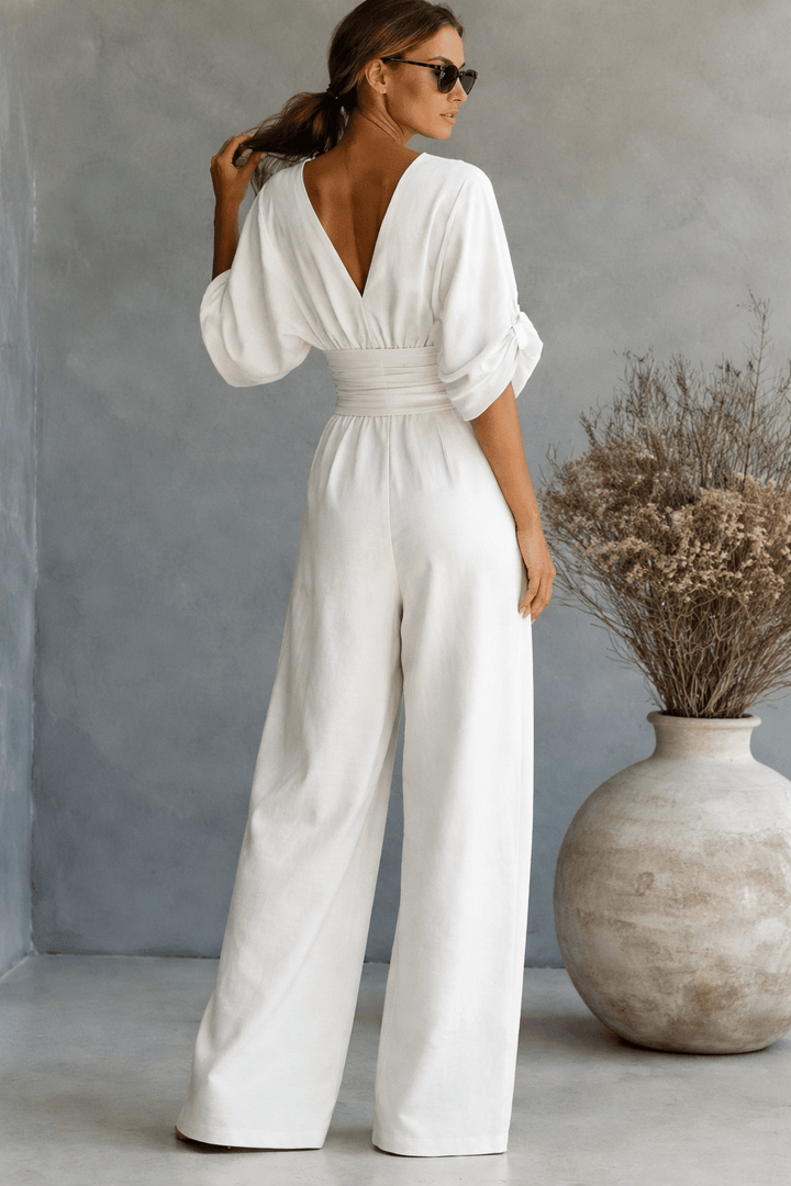 Jumpsuit élégante femme à taille haute, coupe moderne, manches 3/4, confort assuré toute la journée.