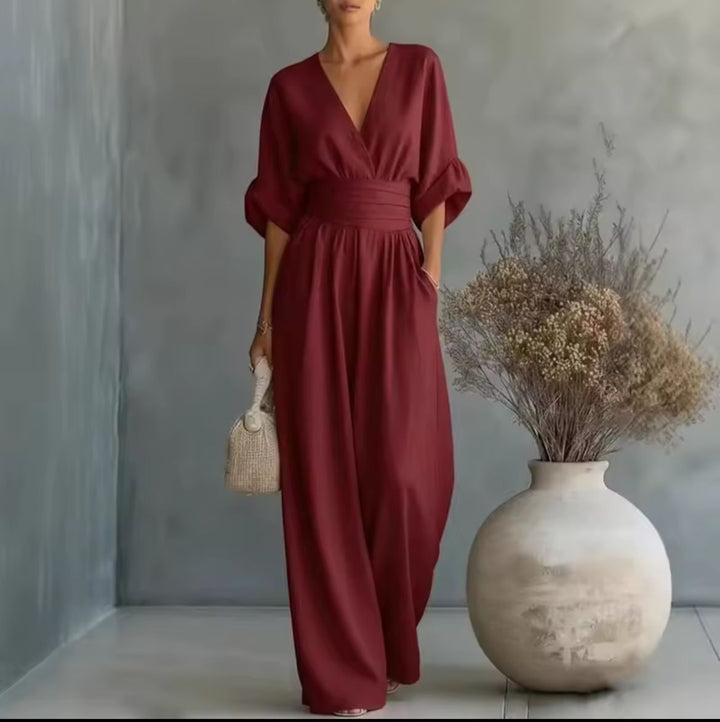 Jumpsuit femme élégante, taille haute, manches 3/4, parfaite pour une tenue chic et confortable au quotidien.
