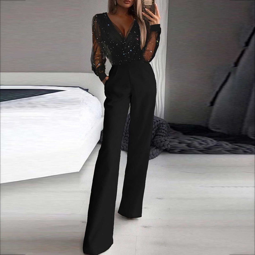 Combinaison femme chic noire à jambes larges, manches longues, parfaite pour soirée élégante.