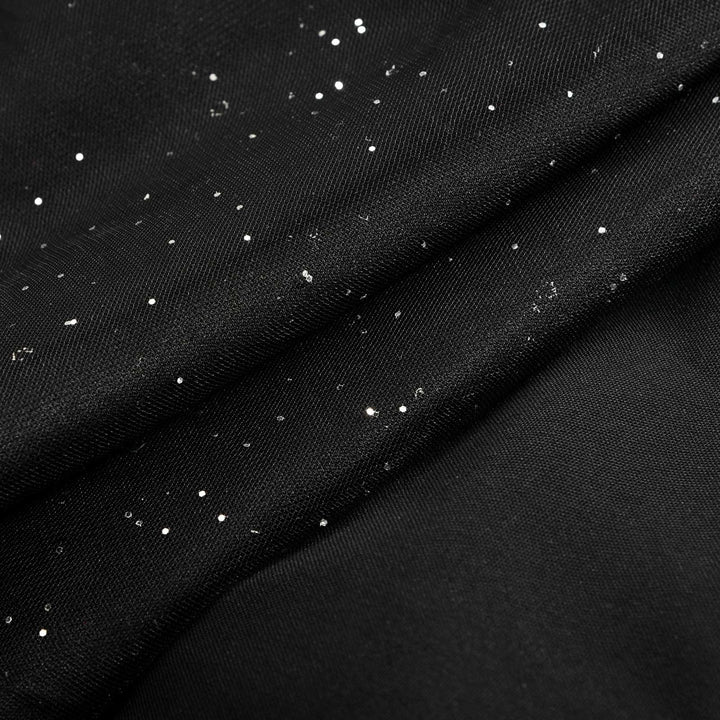 Combinaison femme noire à manches longues et jambes larges, confortable et ultra chic pour toute occasion.