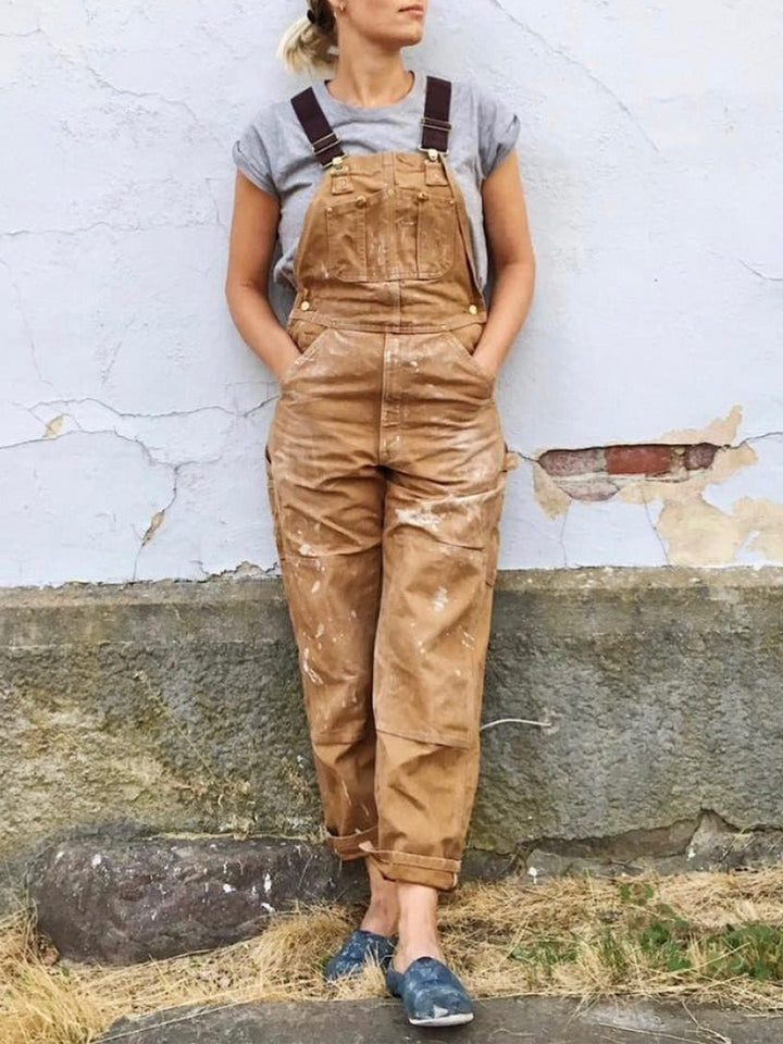 Dos d'une salopette femme en coton, coupe confortable et polyvalente pour le travail ou loisirs.