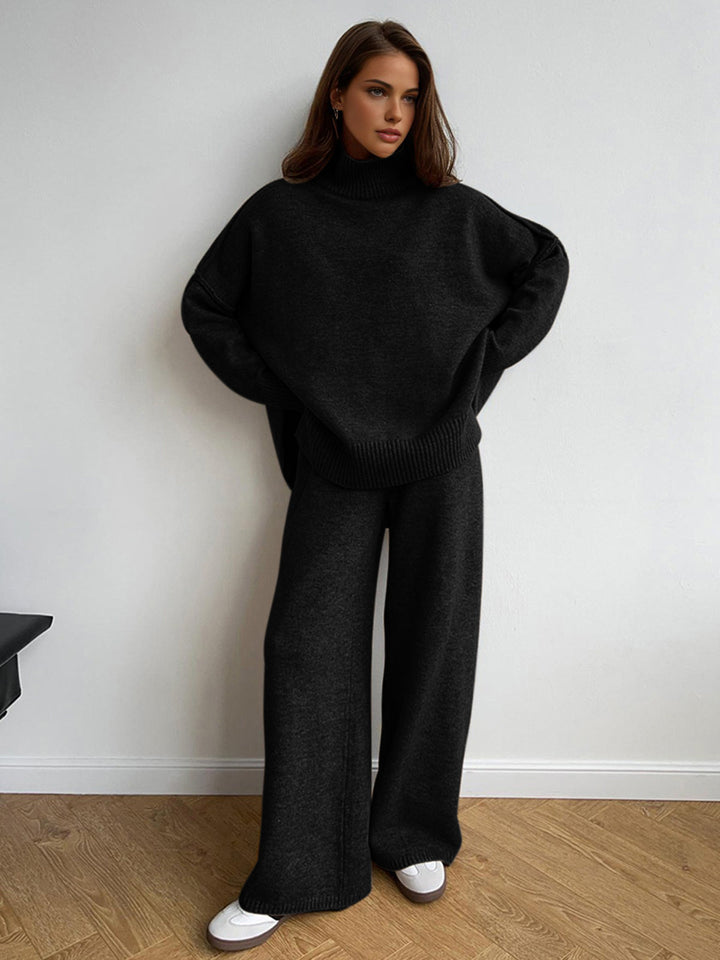 Ensemble maille noire femme: pull col roulé & pantalon large. Parfait pour une tenue chic décontractée.