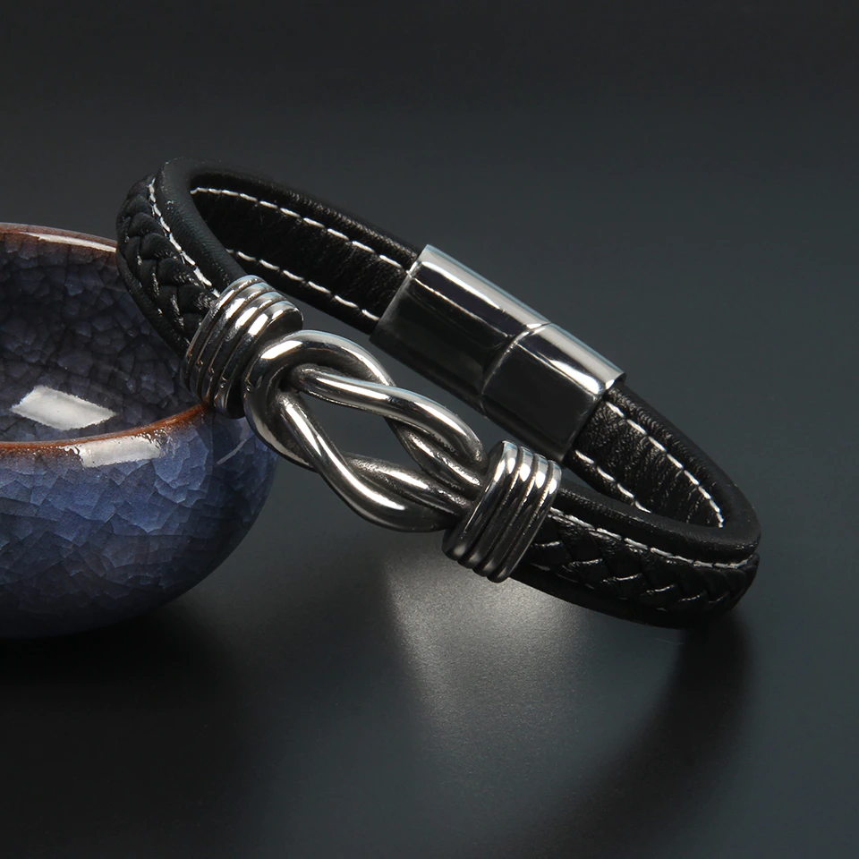 Bracelet unisexe nœud infini noir, élégant accessoire de mode intemporel pour poignet.
