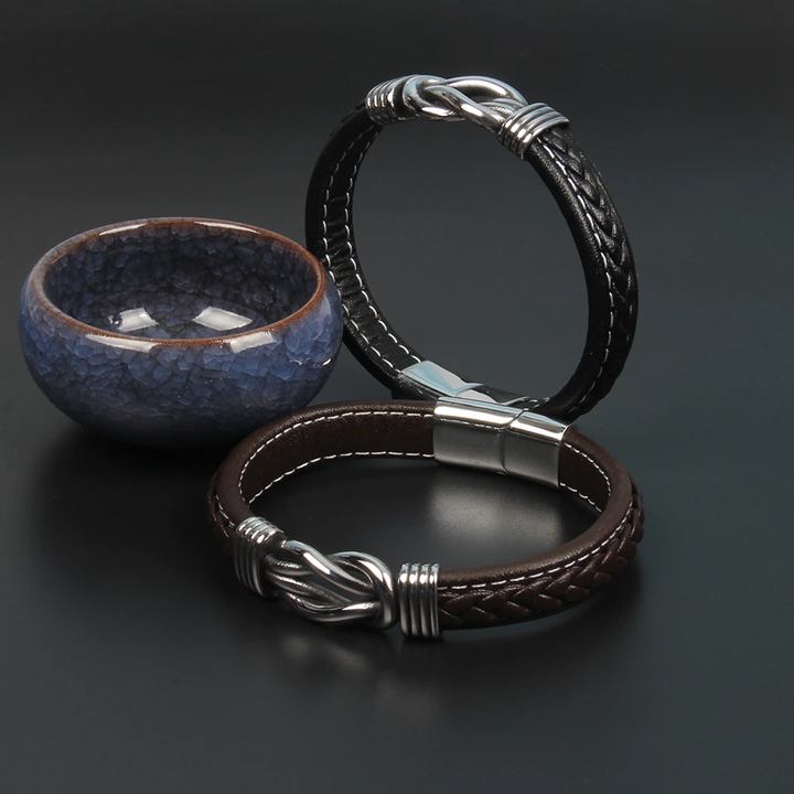 Bracelet noir, motif nœud infini, bijou unisexe élégant pour hommes et femmes.