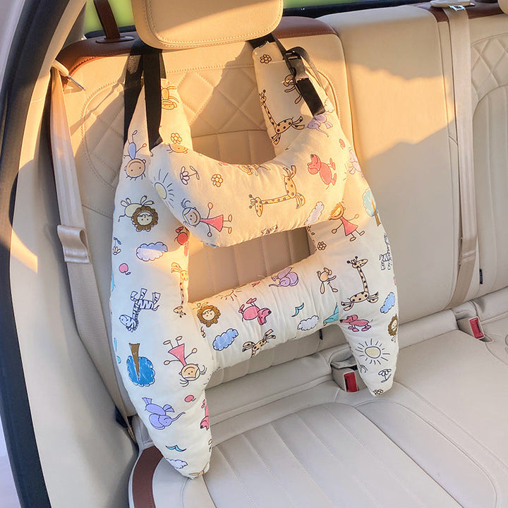 Coussin de voyage ergonomique pour enfant, offrant un soutien doux du cou en voiture, avion ou train.