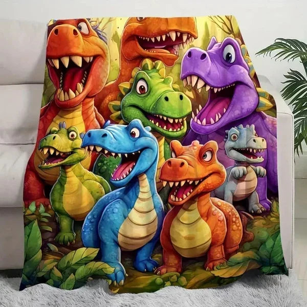Plaid doux dinosaures multicolores pour enfant. Idéal pour un cadeau ou décoration chambre.