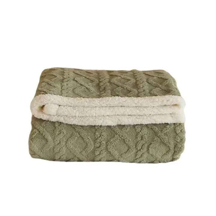Plaid réversible doux en relief pour canapé, offrant confort et style moderne à la décoration intérieure.