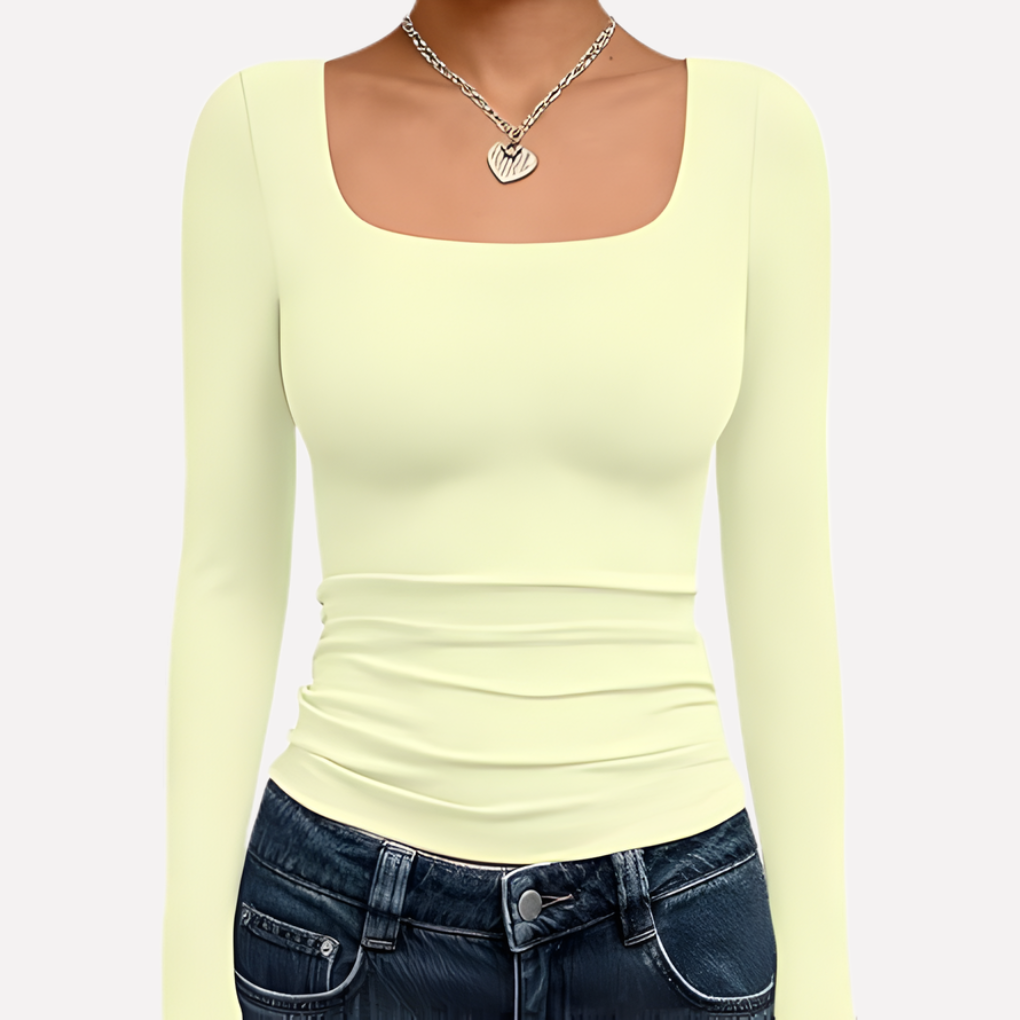 Crop top femme à col carré et manches longues. Noir basique, look moderne et élégant.