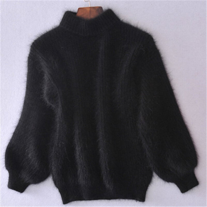 Pull femme élégant, ample et confortable, idéal pour les saisons froides. Look moderne et doux.