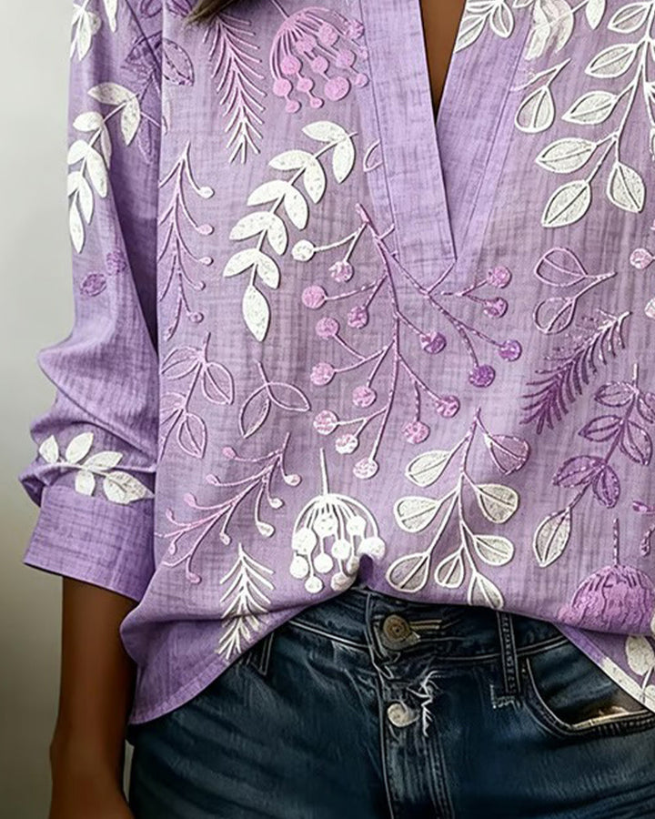 Blouse femme chic à motif floral, coupe fluide, col V, pour bureau ou sorties.