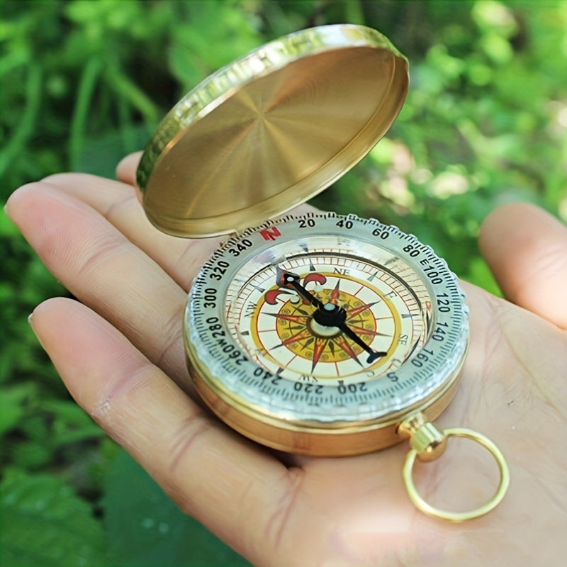 Boussole de survie luminescente pour navigation de nuit, idéale camping et aventure en plein air.
