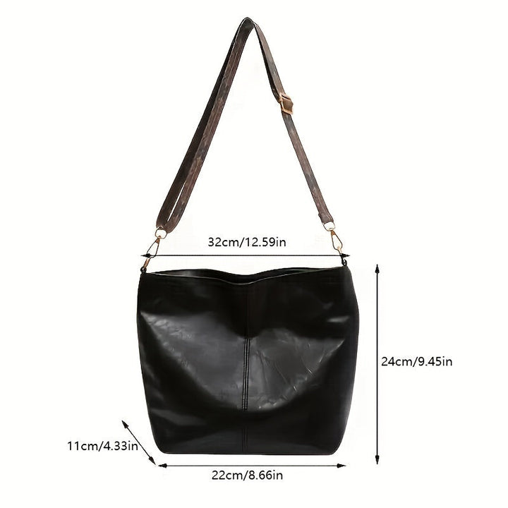 Élégant sac bandoulière géométrique pour femme, style rétro, spacieux et pratique.