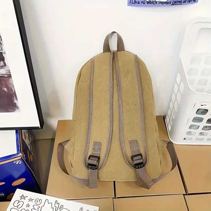 Sac à dos décontracté homme en canvas vert, parfait pour le quotidien et les déplacements urbains.