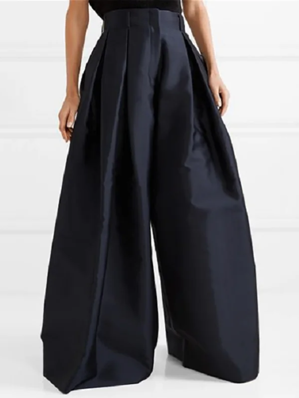 Pantalon plissé femme taille haute, coupe jambe large. Tissu fluide pour confort et élégance décontractée.