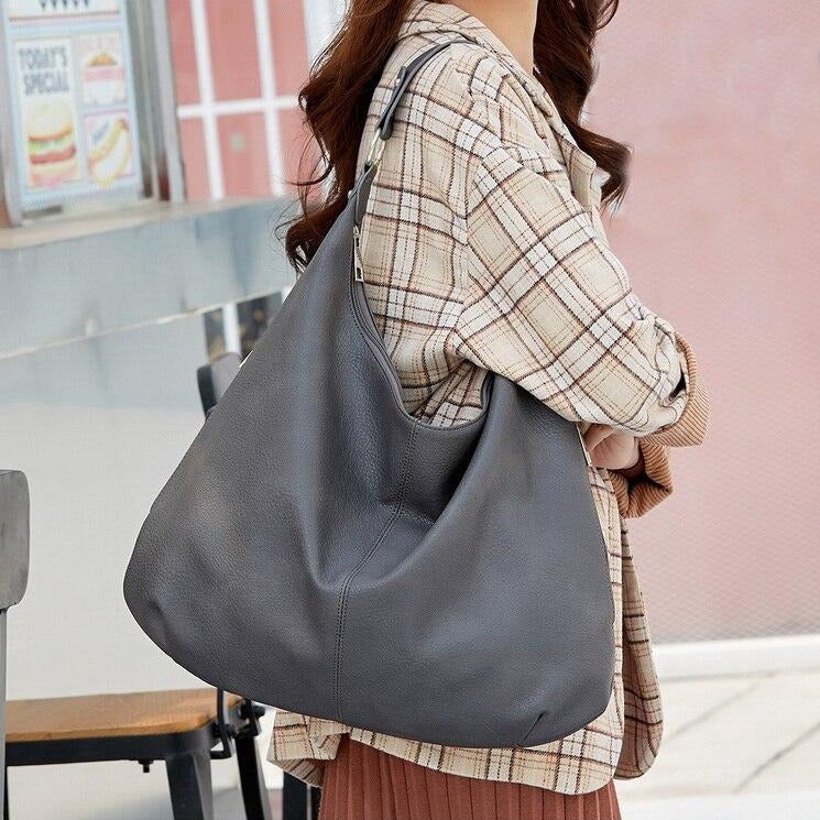 Sac à main Mila élégant avec bandoulière amovible, chic et pratique pour femme moderne.