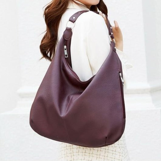 Sac à main Mila, l'accessoire de mode féminin par excellence, élégant et sophistiqué.