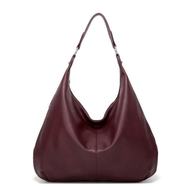 Élégant sac à main Mila, accessoire de mode pour femme, alliant style, organisation et polyvalence.