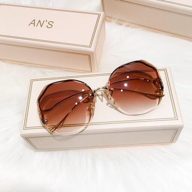 Lunettes de soleil unisexe dégradées, style luxe mode été, protection UV chic.