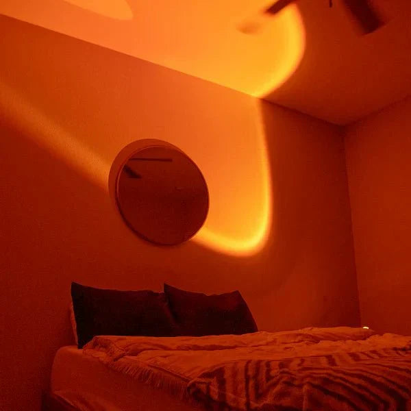 Lampe LED moderne avec projection de couleurs vives imitant un coucher de soleil. Parfaite pour créer une ambiance relaxante.