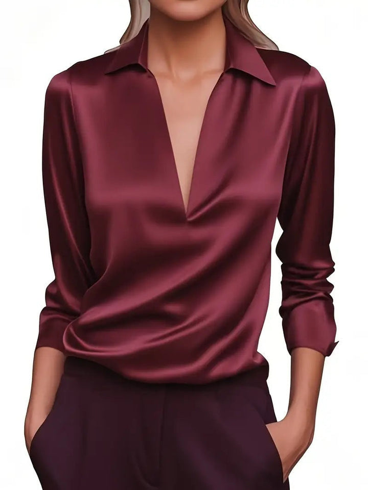 Blouse femme moderne à col V, manches longues. Chemisier élégant et fluide, disponible en plusieurs couleurs.