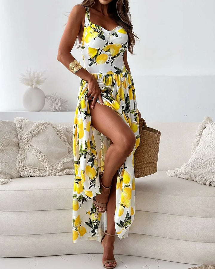 Superbe robe longue femme jaune à motifs floraux. Parfaite pour une cérémonie d'été ou un événement élégant.