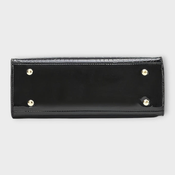 Sac à main femme motif crocodile brillant, design pratique et moderne pour un look sophistiqué au quotidien.