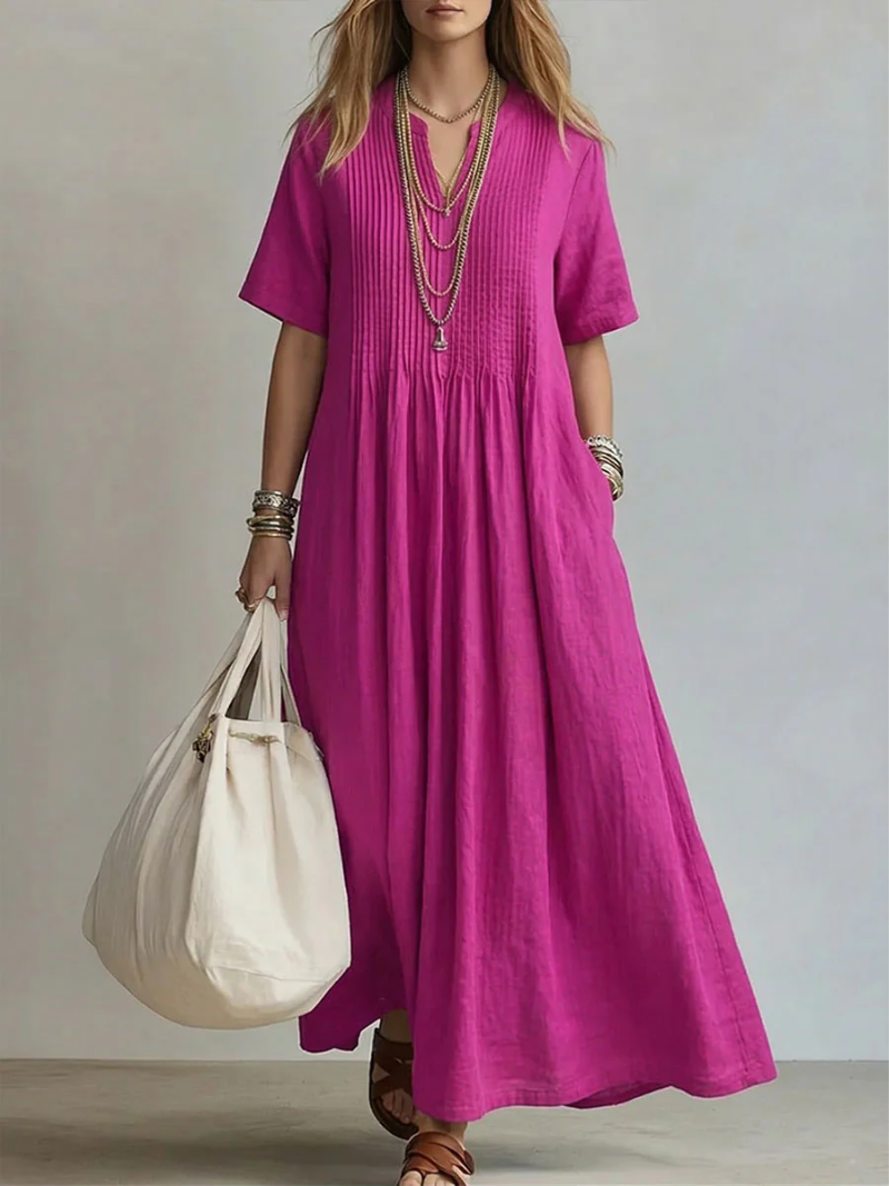 Robe maxi fluide femme en coton, col V, manches courtes, idéale pour l'été et les vacances. Élégante et confortable.