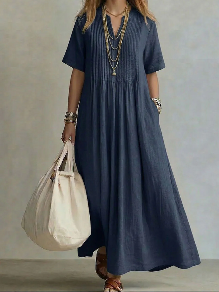 Robe maxi femme décontractée en coton lin, coupe fluide et confortable pour la saison chaude.