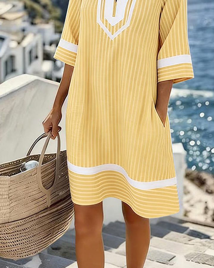 Robe élégante femme rayée, coupe droite et col V. Parfaite pour le printemps-été, très confortable.