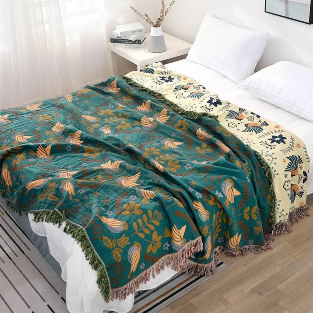 Couverture scandinave réversible motifs oiseaux, idéale pour la décoration intérieure et le confort.