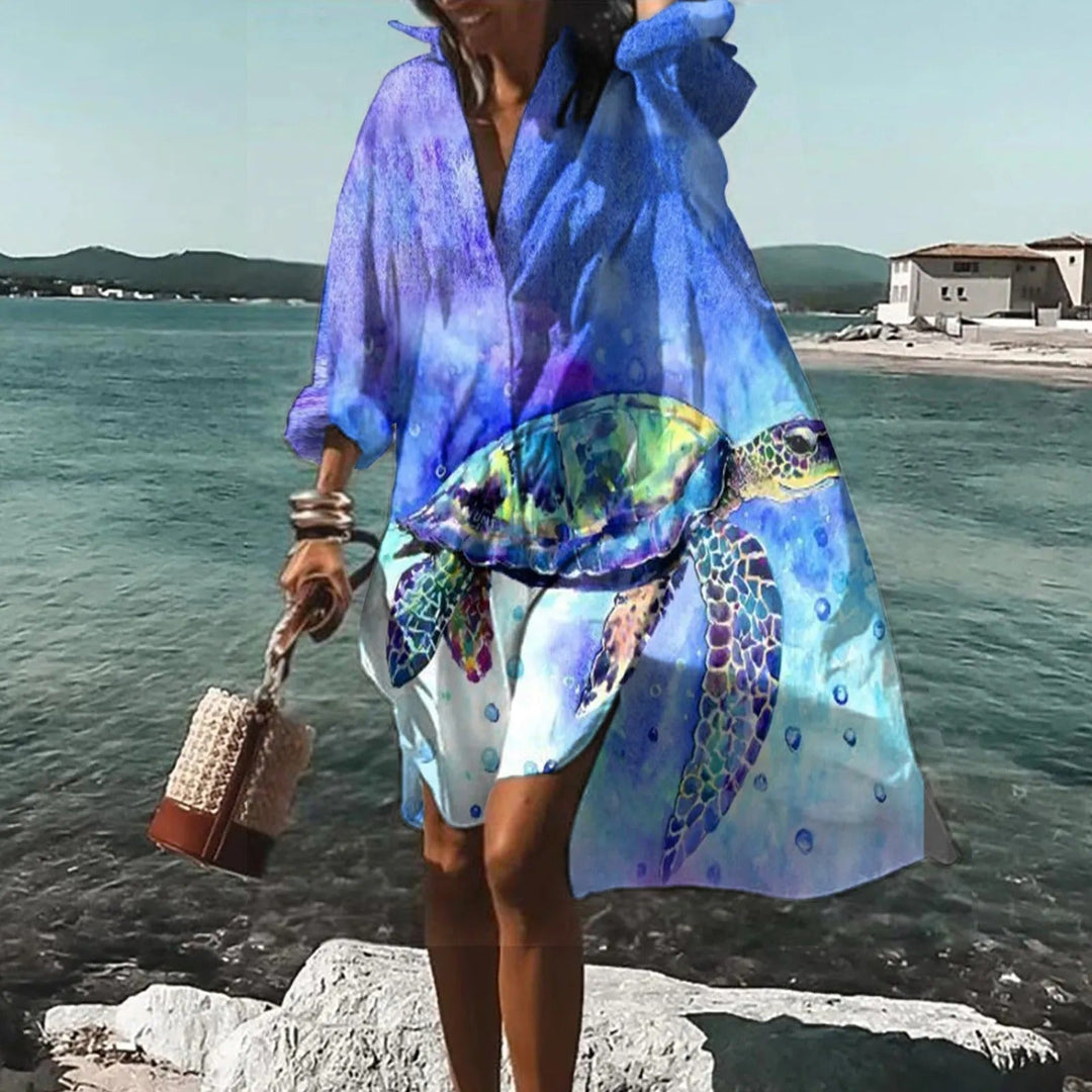 Modèle: Robe chemise d'été midi décontractée femme, tissu léger et fluide, idéale pour la plage et les vacances.