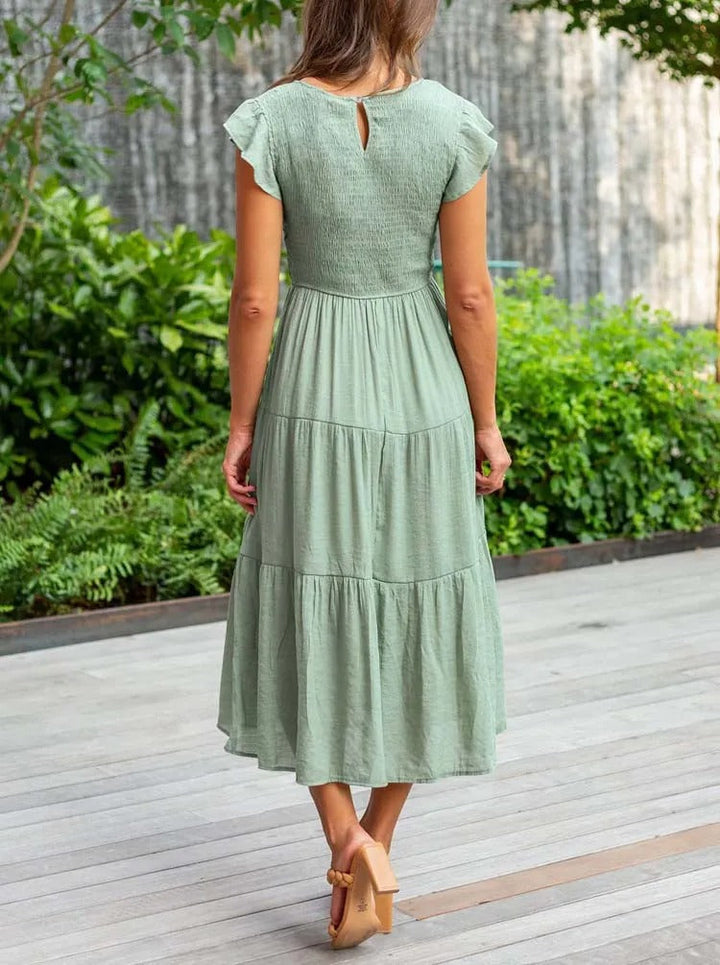 Vêtement femme chic: robe élégante et raffinée, assurant confort et un bel effet ventre plat.