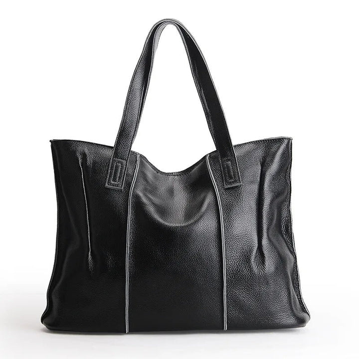 Sac de cours femme en cuir marron, élégant et spacieux pour le travail ou les études.
