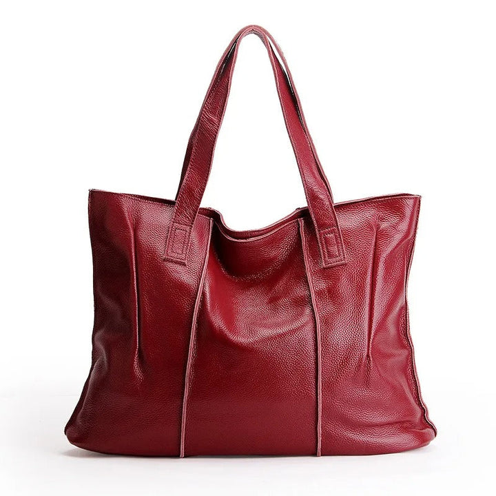 Élégant sac de travail en cuir noir pour femme, style cabas vintage, grand compartiment.