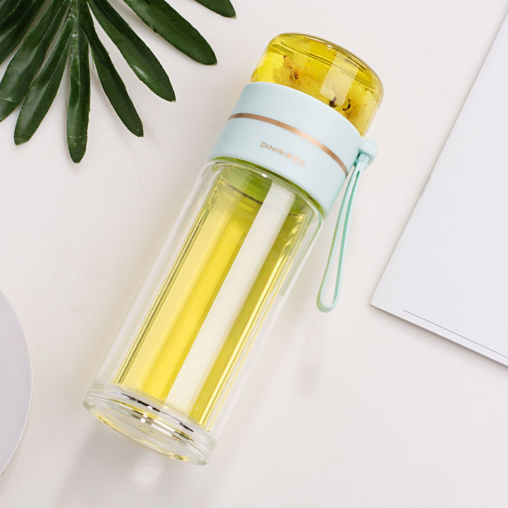 Bouteille en verre isotherme PureBrew avec infuseur pour thé, eau fruitée ou autres boissons rafraîchissantes.