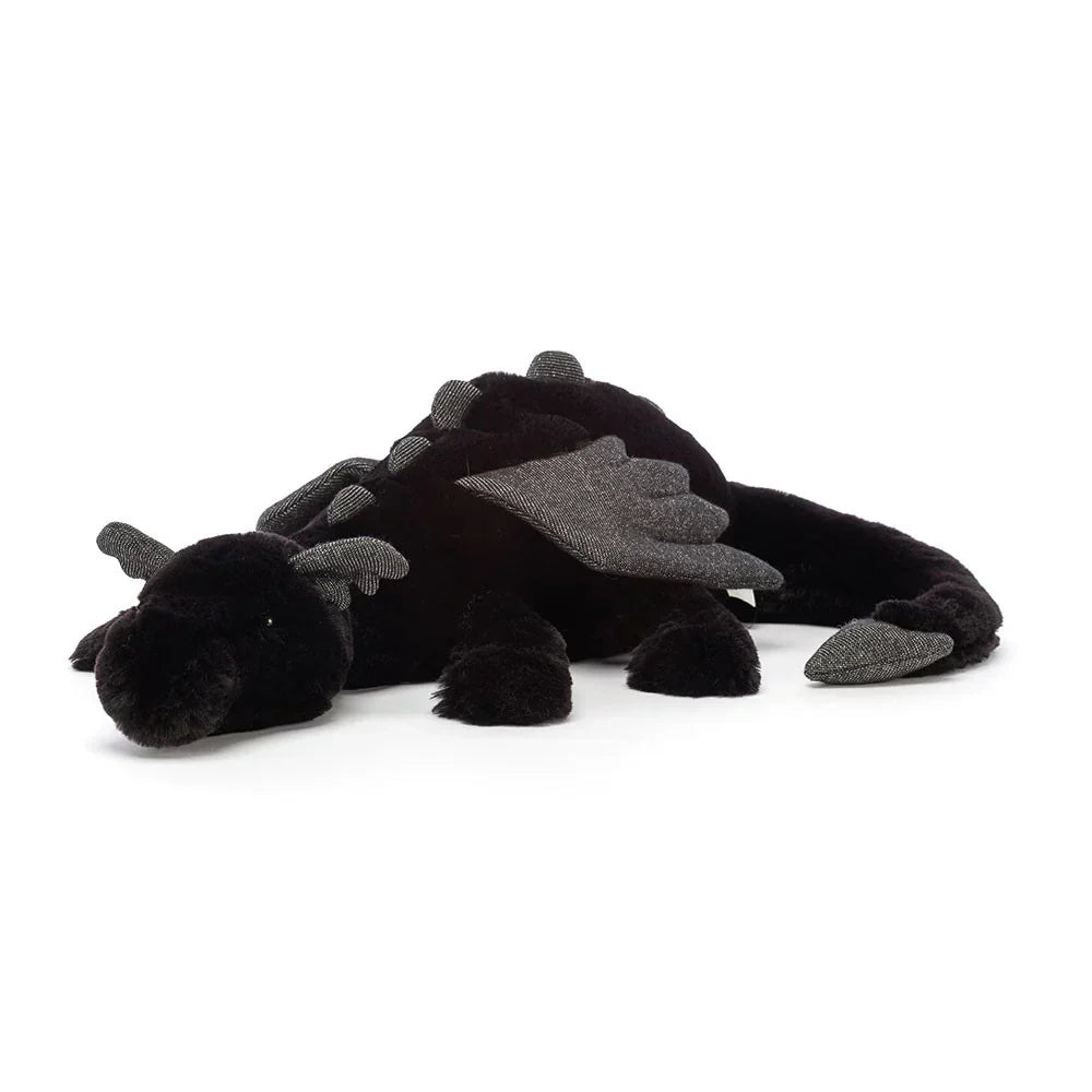 Peluche dragon polyvalente, jouet câlin ou décoration de chambre. Apporte fantaisie et douceur à l'espace.
