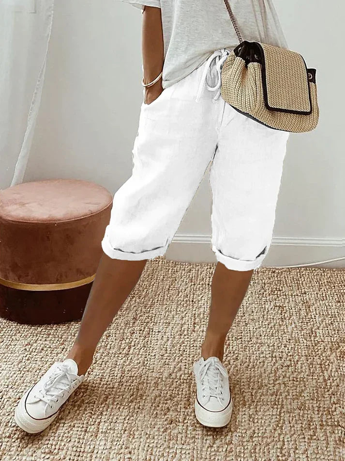Pantalon femme fluide noir taille haute, léger et confortable, idéal pour un look chic décontracté d'été.