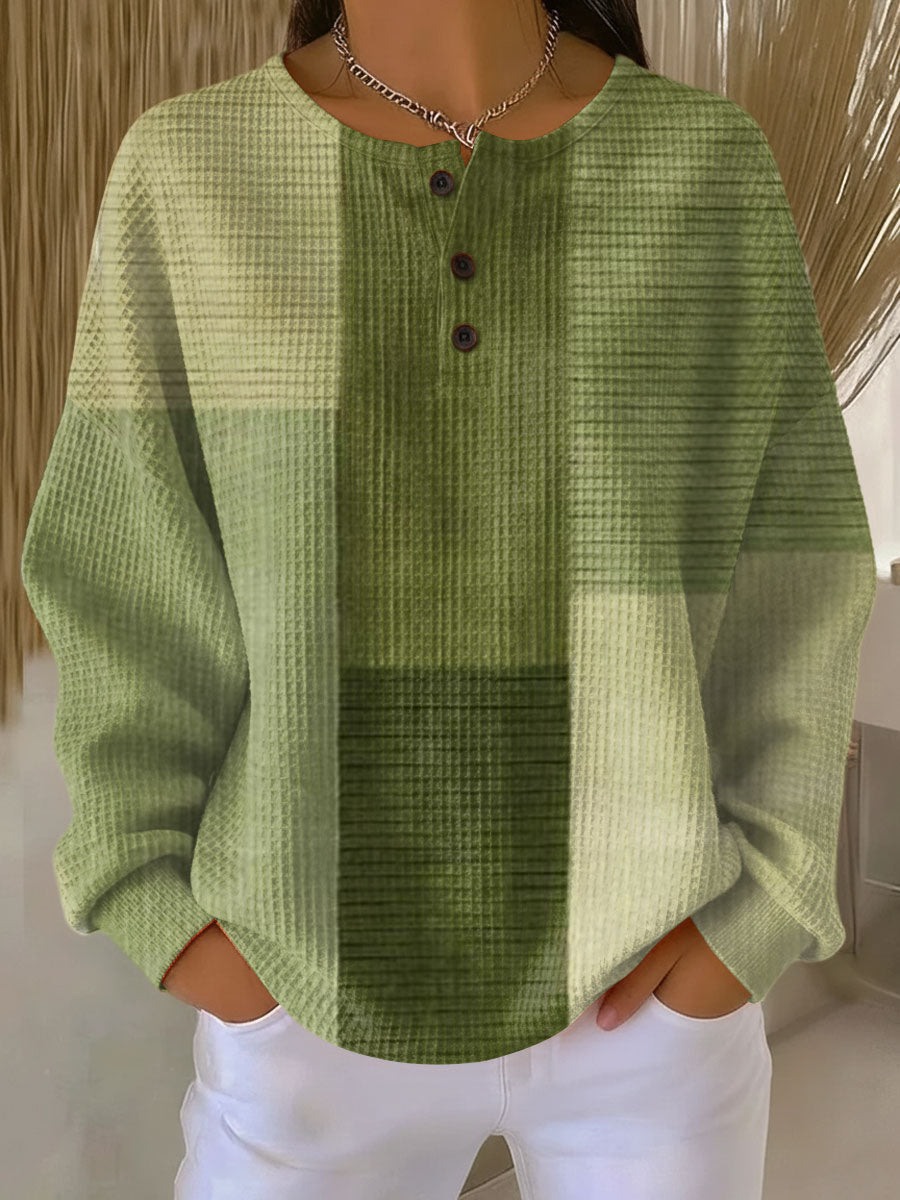 Pull femme confort tricot gaufré, idéal pour les froides journées d'hiver.