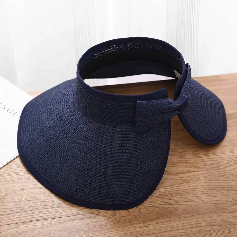 Chapeau visière femme ajustable en paille tressée, bord large. Accessoire mode bohème pour activités estivales.