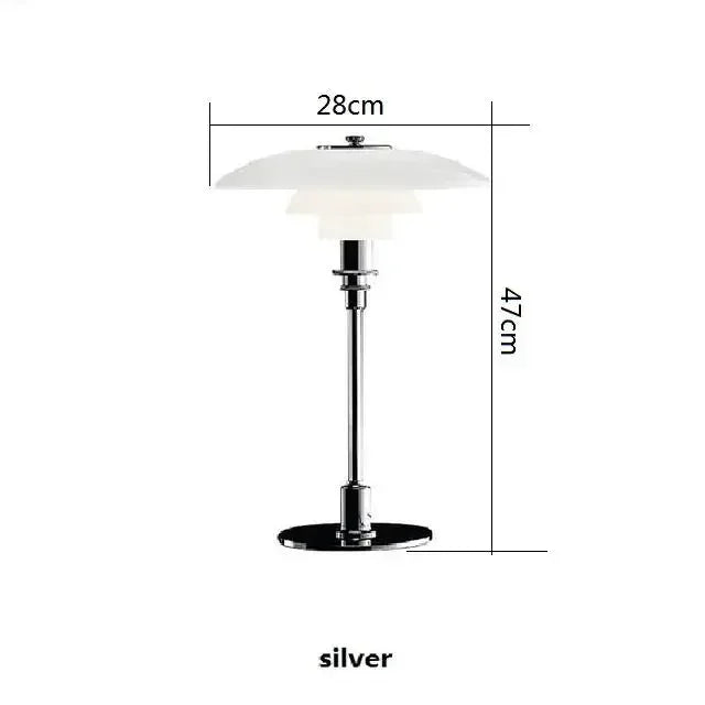 Suspension design AuroraGlow en verre transparent, au-dessus d'une table basse.