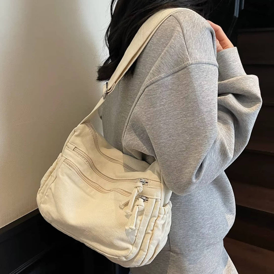 Sac élégant pour femmes en toile résistante, design rétro, bandoulière ajustable. Idéal organisation.