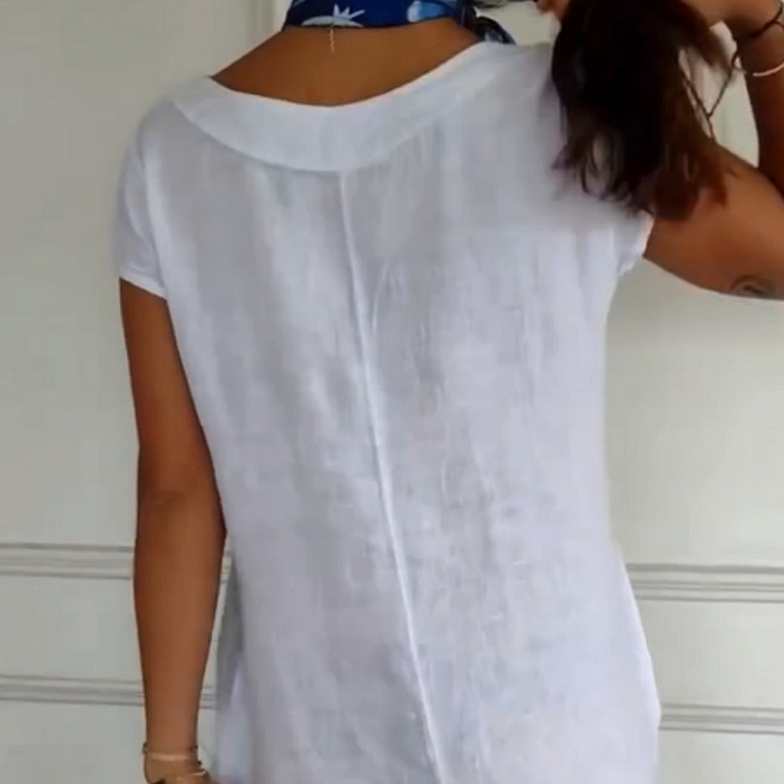 Vue de face : Robe estivale femme, lin coton, coupe ample et fluide, col rond, poches, style décontracté.