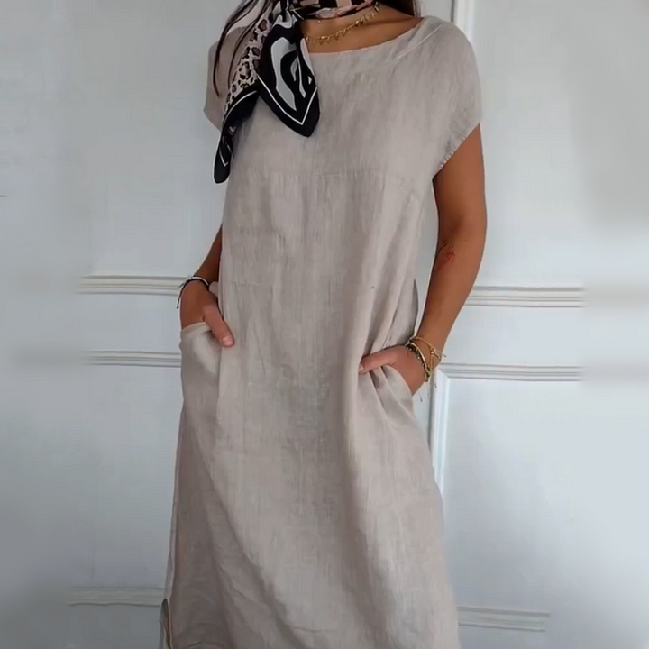 Robe femme élégante et ample en lin coton, col rond, poches, parfaite pour un look estival confortable.